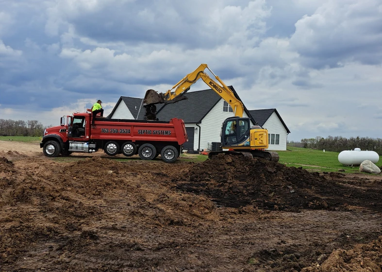 Construction site with excavator and truck